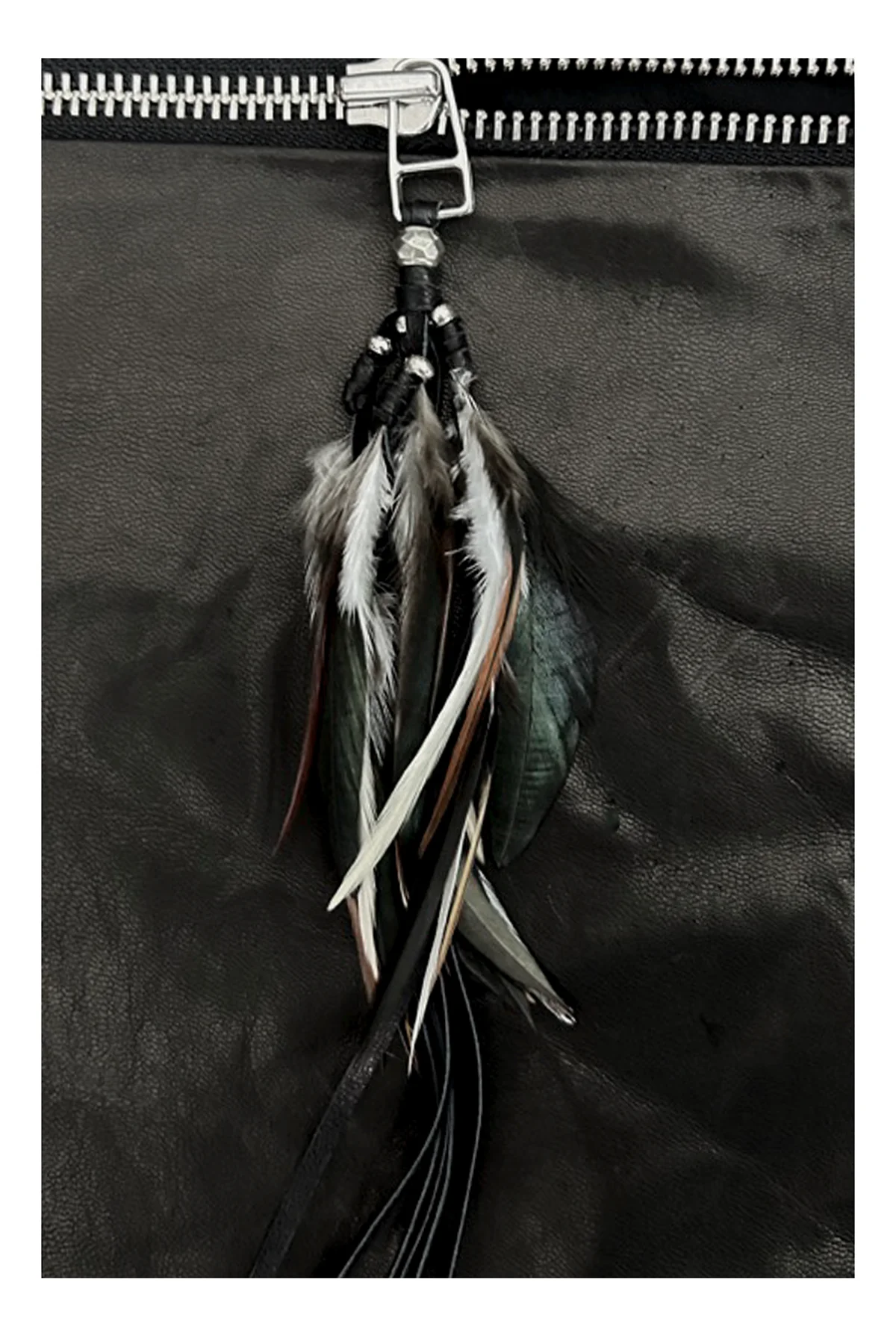 Feathers on zipper